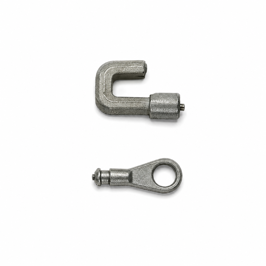 Precision zinc die cast speedometer link components manufactured by SNAA Products for automotive instrumentation systems.