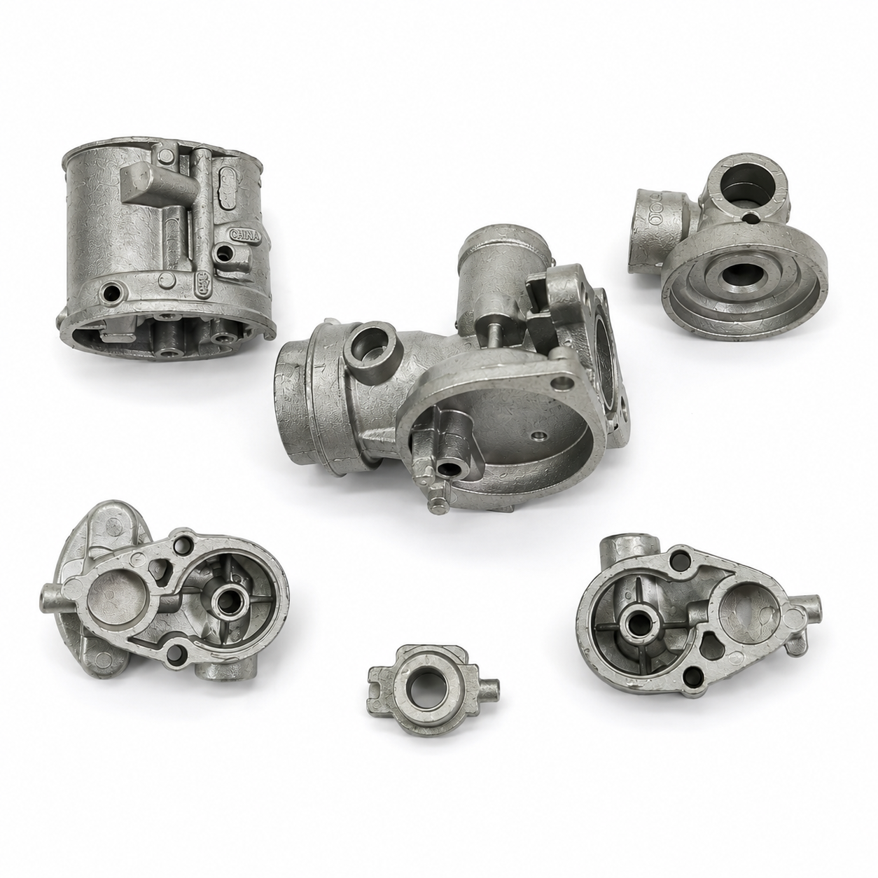 Precision zinc die cast carburetor and fuel system components manufactured by SNAA Products for motorcycles and automotive applications.