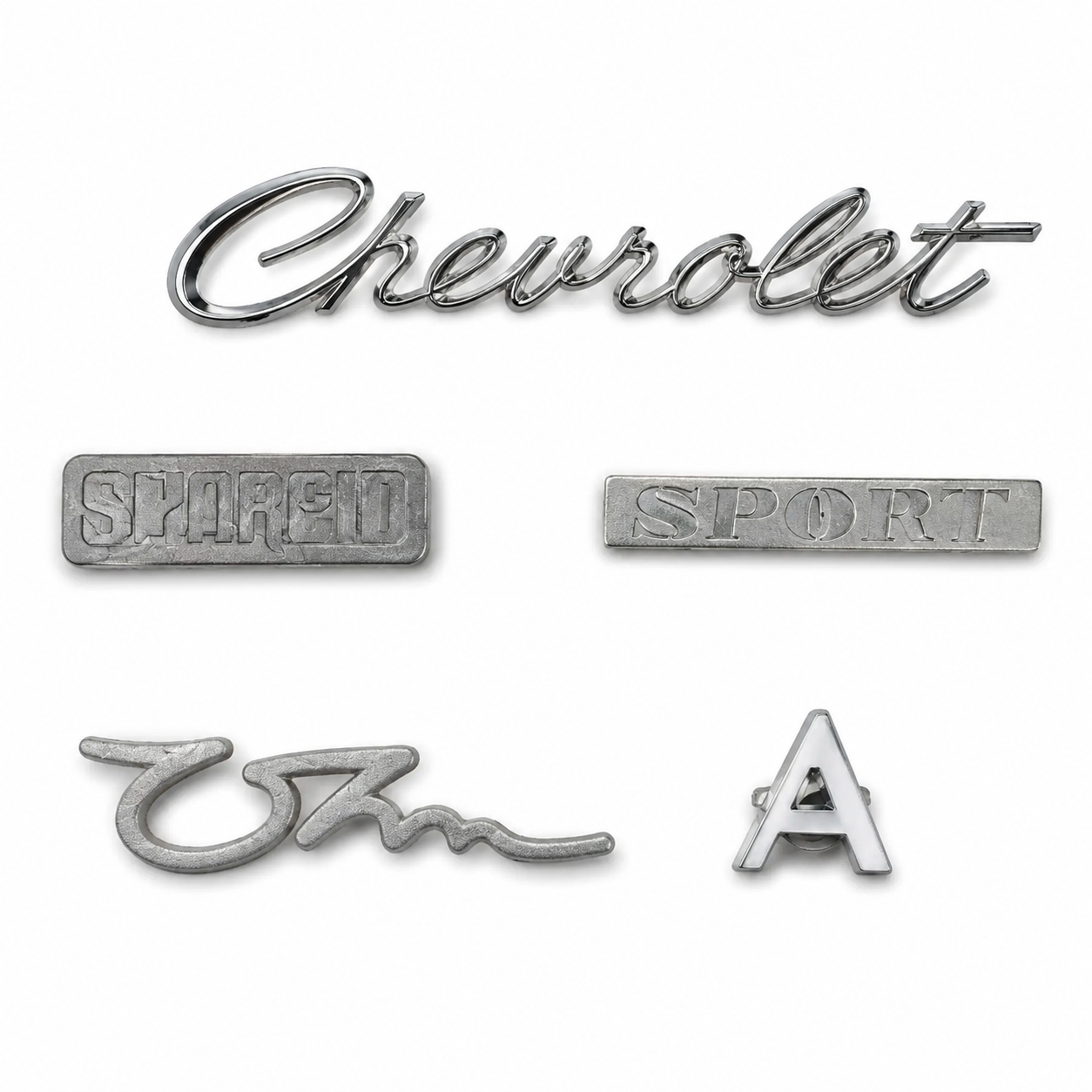 Zinc die cast automotive monograms and emblems manufactured by SNAA Products for vehicle branding, model identification, and decorative automotive applications.